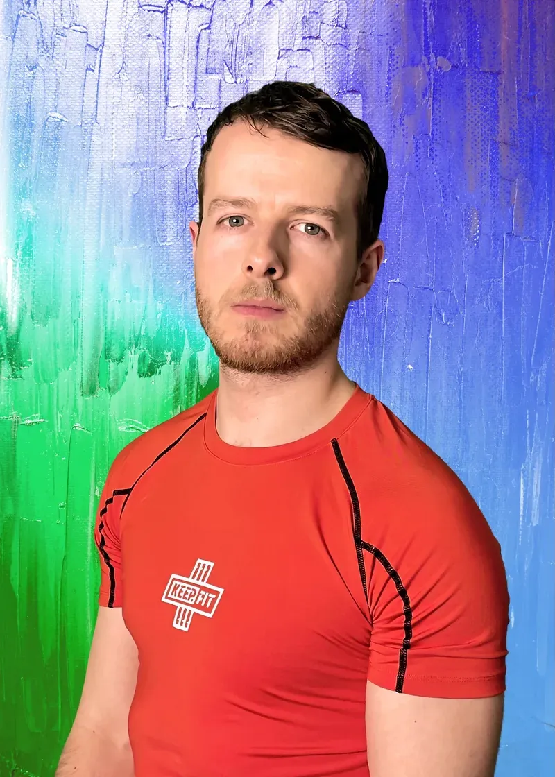 Owen Jones wearing a red KEEP.FIT training top.